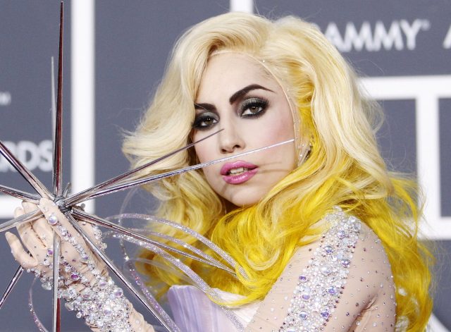 Lady Gaga poses on the red carpet at the 52nd annual Grammy Awards in Los Angeles